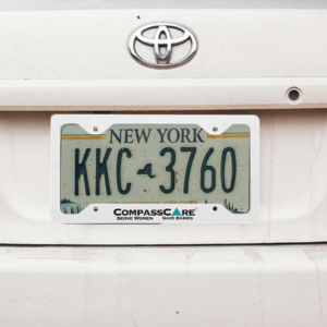 CompassCare metal license plate frame